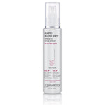 A clear Giovanni Cosmetics RAPID BLOW-DRY SHIELD AND STYLE SPRAY bottle with pink and black text stands on a white background—ideal for all hair types, offering frizz control and heat protection during blow-drying.