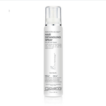 A white 7 oz bottle of Giovanni Cosmetics SMOOTH AS SILK™ HAIR DETANGLING SPRAY for all hair types, with a pump spray cap; helps detangle and protects hair from heat.
