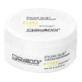 A white container of Giovanni Cosmetics STYLING GLUE™ CUSTOM HAIR MODELER, 2 oz (57 g), featuring black text and yellow dots on the lid and side. This salon-quality, color-safe styling glue provides a strong hold while caring for your hair.