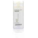 A 2 oz (60 ml) travel-size bottle of Giovanni Cosmetics TEA TREE TRIPLE TREAT™ Invigorating Conditioner with green accents and a clear cap sits on a white background. This color-safe formula refreshes and revitalizes all hair types.