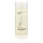 Giovanni Cosmetics TEA TREE TRIPLE TREAT™ INVIGORATING SHAMPOO (TRAVEL SIZE) is a 2 fl oz clear bottle with a white cap, designed for all hair types and formulated to boost scalp circulation with Eco Chic Technology.