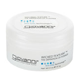 A white plastic jar of Giovanni Cosmetics WICKED TEXTURE™ THE DEFINITION OF POMADE, with black and blue text on the lid and side, vegan, net weight 2 oz (57 g).