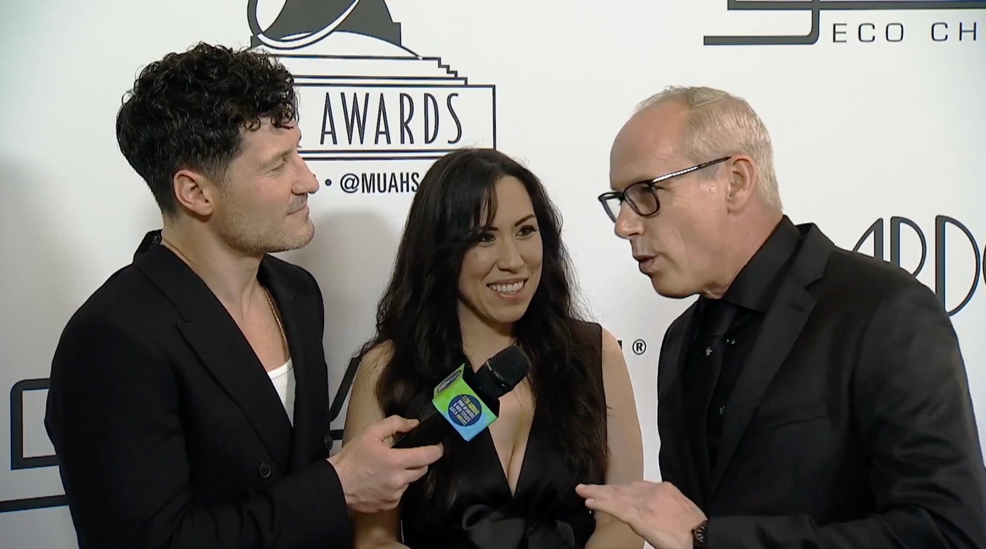 Giovanni being interviewed on the red carpet at the MUAHS Awards
