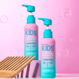 Two bottles of Giovanni Cosmetics ECO CHIC® KIDS LEAVE-IN CONDITIONING & STYLING ELIXIR with teal pumps are shown on a pink background amid bubbles and a wooden comb, highlighting tangle-free, easy hair styling.