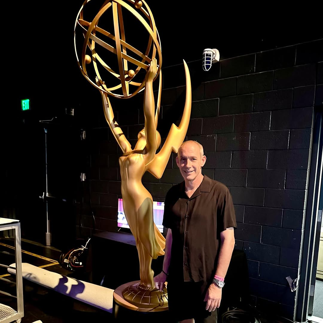 Giovanni next to the Emmy statue
