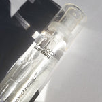 A clear bottle labeled L.A. HOLD™ HAIR SPRITZ by Giovanni Cosmetics sits on a white surface in sunlight, ideal for anyone seeking salon-quality, color-safe hair spray.