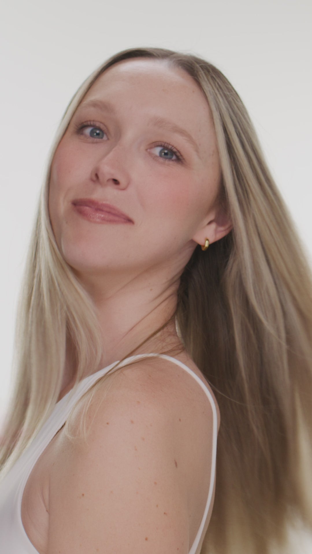 Video of blonde model using Giovanni Color Chic Purple Shampoo, Conditioner and Styling & Toning Foam