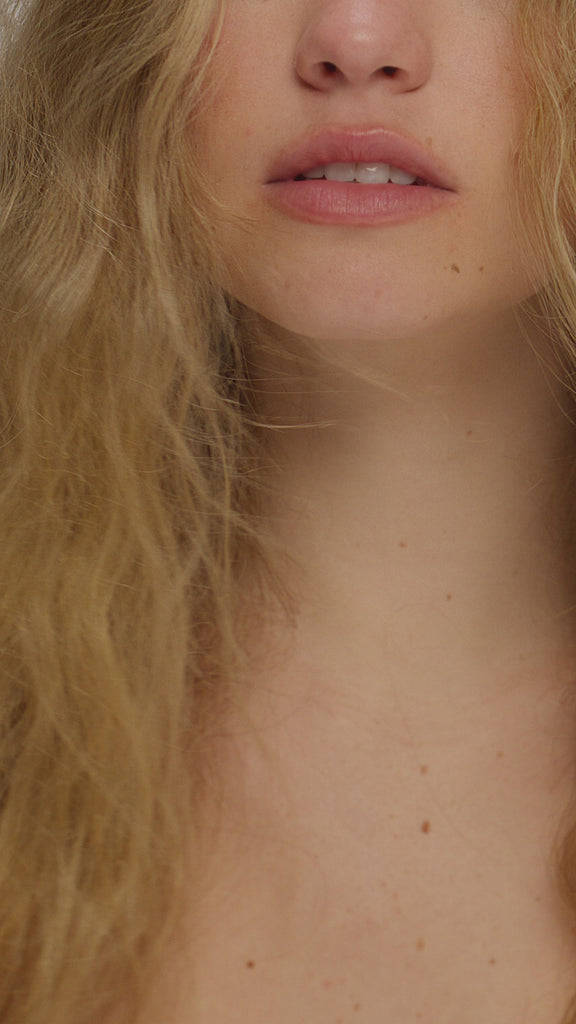 Video of blonde with frizzy hair using Smooth As Silk Shampoo & Conditioner showing before and after results. 
