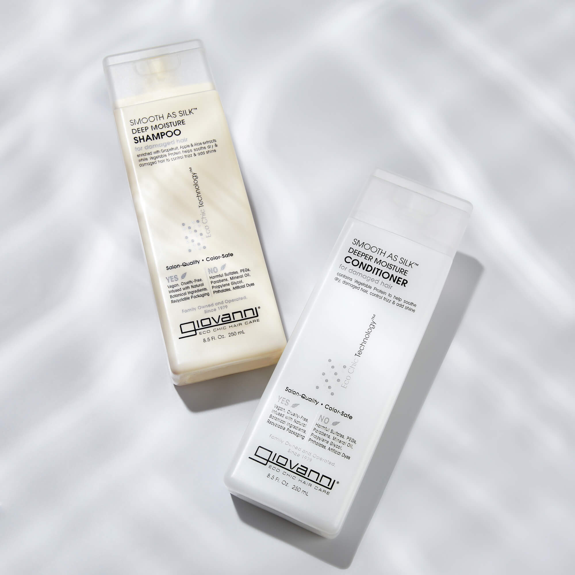 Bottles of Giovanni Smooth as Silk Deep Moisture Shampoo and Conditioner